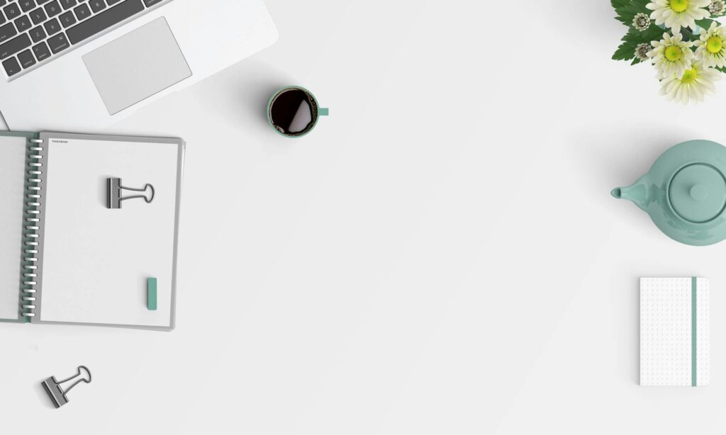 pexels-photo-434337-434337 Clean minimalist workspace with a laptop, coffee, flowers, and stationery.