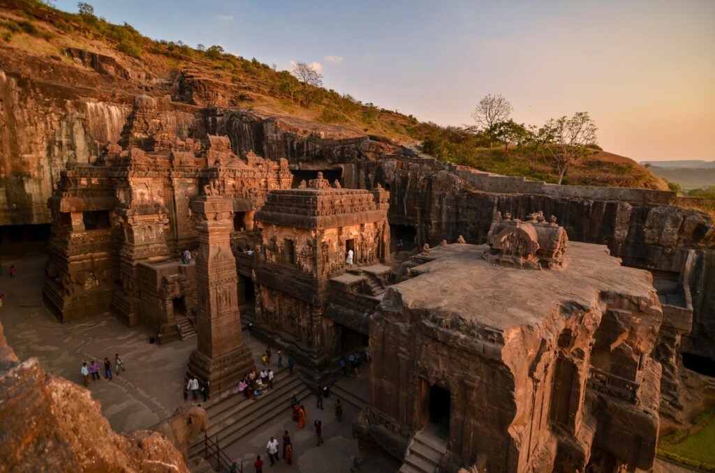 pexels-photo-4882671-4882671 A breathtaking view of the ancient Ellora Caves captured at sunset, showcasing intricate stone carvings.